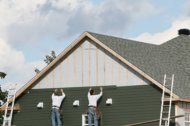 Professional Siding technician working in Home, PA